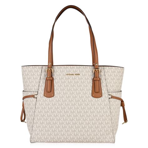 michael michael kors grained leather voyager tote bag|Michael Kors Tote with zipper.